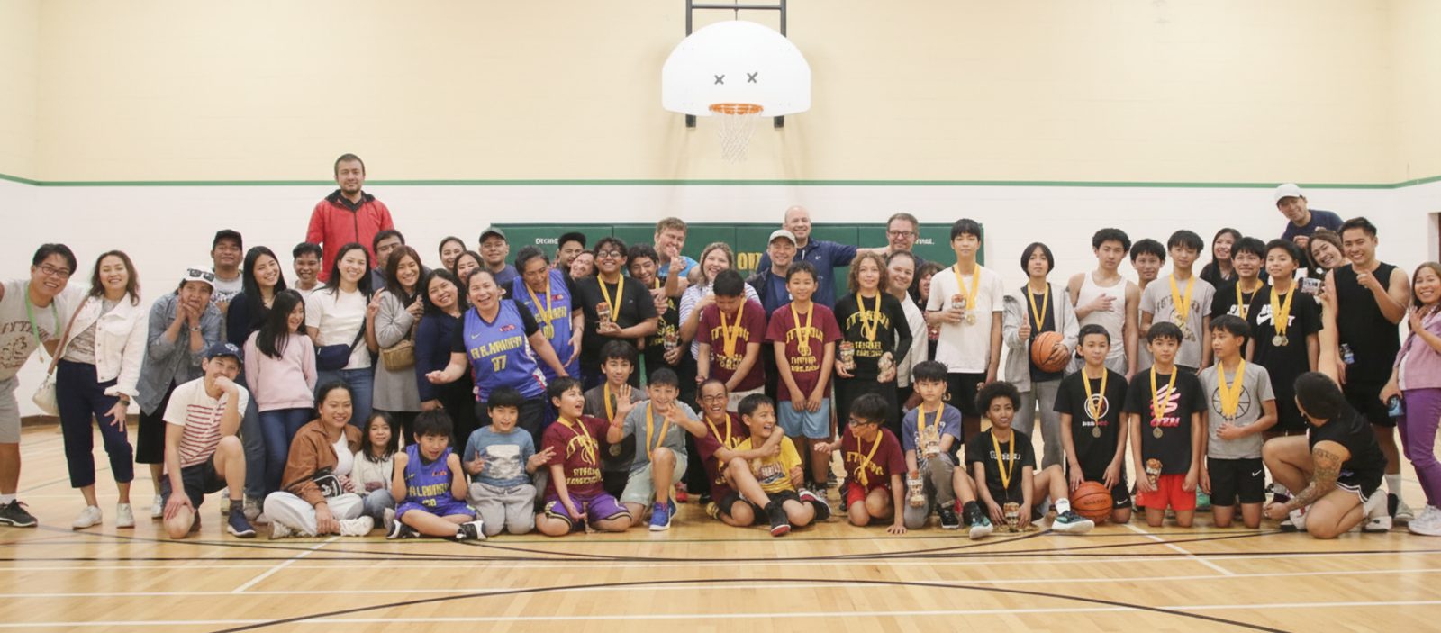 PBA Ottawa Titans players, coaches, volunteers, and families together after a game